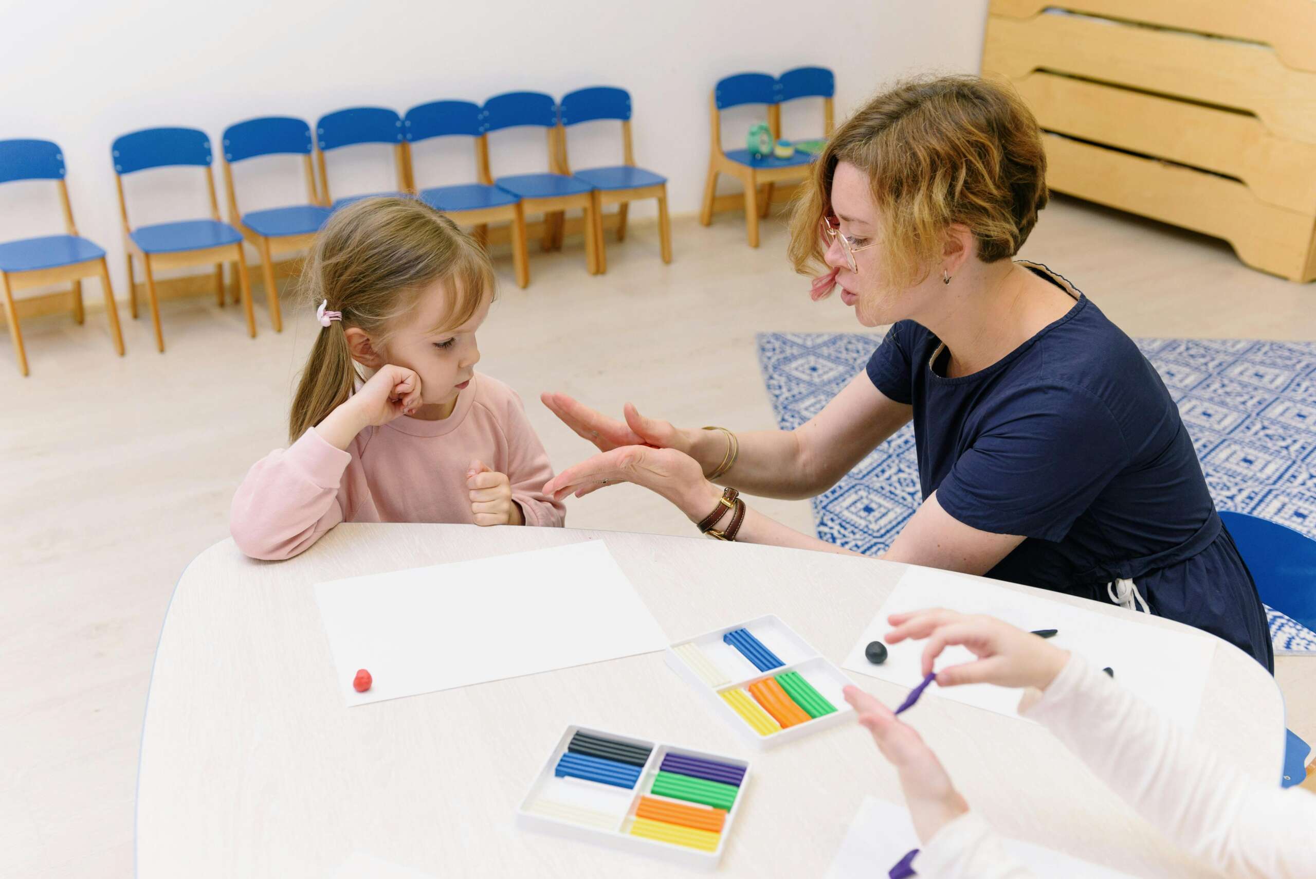 Registered Behavior Technician (RBT) providing 1-on-1 ABA therapy for a child with autism at ABI New England.
